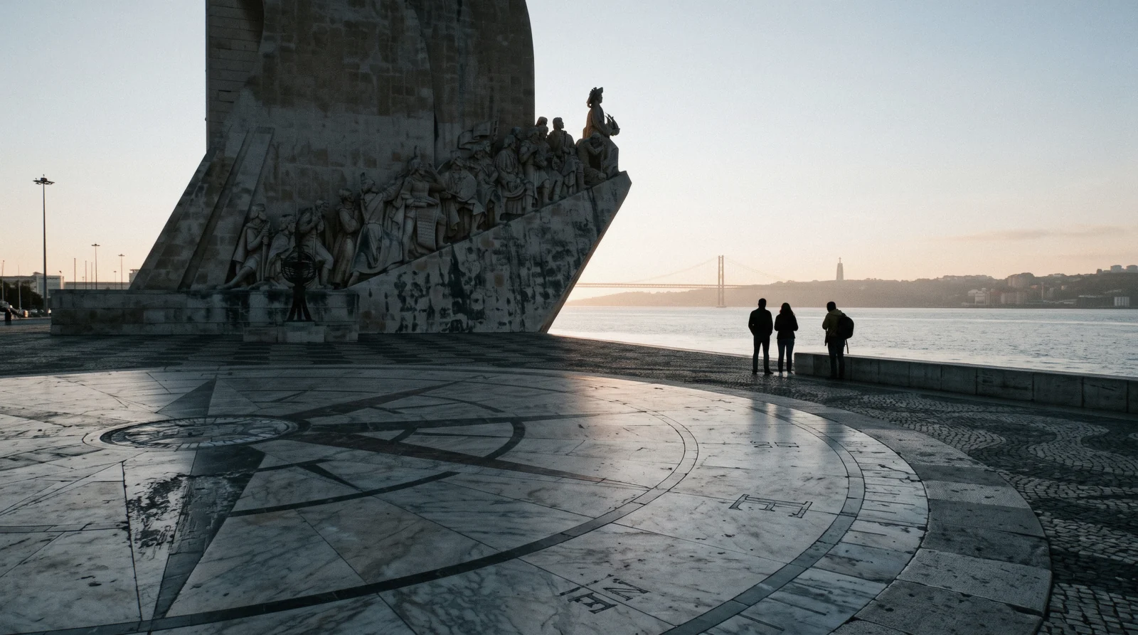 The caravel prow of the Monument to the Discoveries against the Tagus at 17:50 with the compass rose pavement in front, Monument to the Discoveries Lisbon